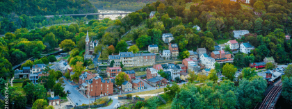 Aerial view of a picturesque West Virginia town nestled in lush mountains.