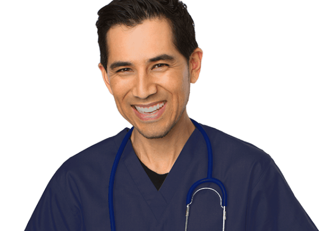 Male doctor in blue scrubs with a stethoscope